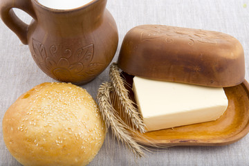 clay jug with milk, bread and butter