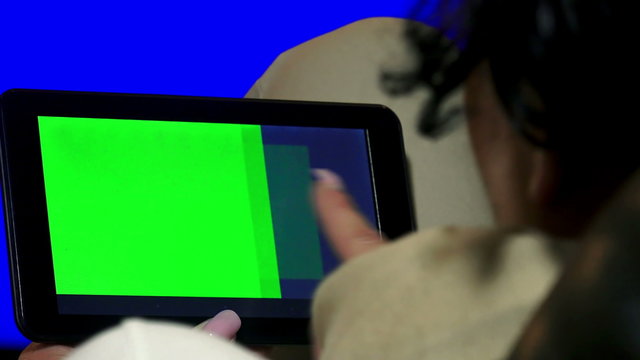 Girl Using Tablet PC with Green Screen., 