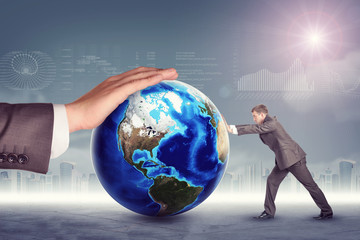 Businessman pushing planet with mans hand