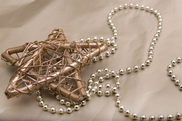 Gold Christmas star with golden beads