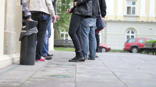 Young people smoke cigarettes