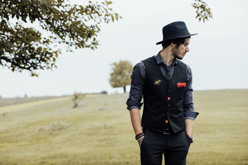 stylish man on a green field