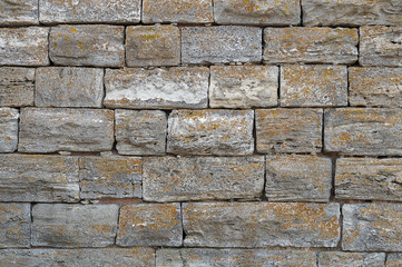Detail of a wall built of gray bricks