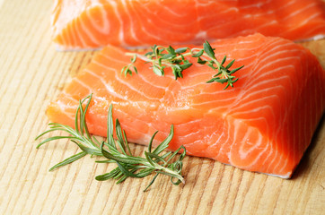 Raw salmon on cutting board