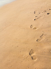 Fototapeta na wymiar Footprints, shoe on the sand