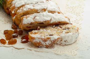 Fresh Christmas Stolle Dresden with raisins closeup on a beautif