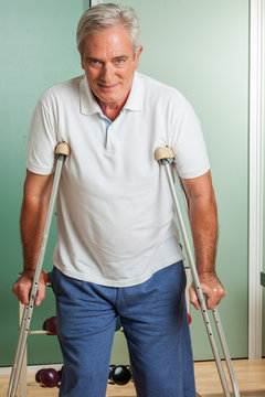 Elder Man Using A Crutches