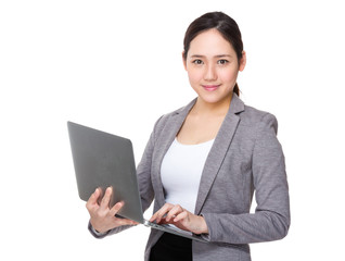 Asian Businesswoman use of the notebook computer