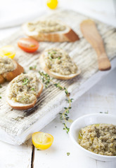 Bruschetta with green olives paste, tapenade on a white background