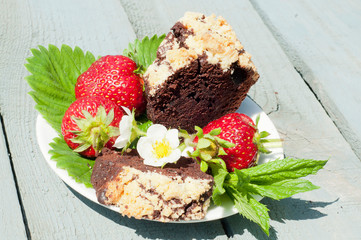 cake with strawberry on the blue wooden background