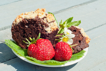 cake with strawberry on the blue wooden background