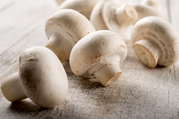 Fototapeta na wymiar mushrooms on aged table