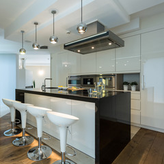 Contemporary kitchen with designer chairs
