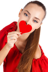 Portrait of beautiful girl with red heart