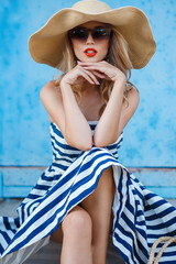 Summer portrait of a woman in a straw hat - 95114878