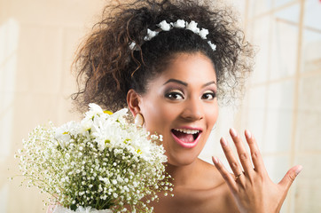 Excited bride showing her wedding ring