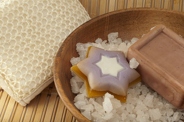sea ​​salt in wooden bowl of natural soap, washcloth from na