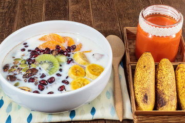 Homemade Chocolate Granola with nuts, mix fruits, Milk and Carrot juice, Healthy food.