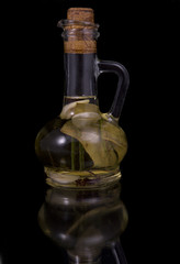 appetizing bottle of olive oil infused with spices, garlic and b