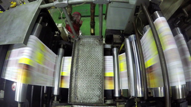 Close-up of printing mechanism rolling freshly typed 