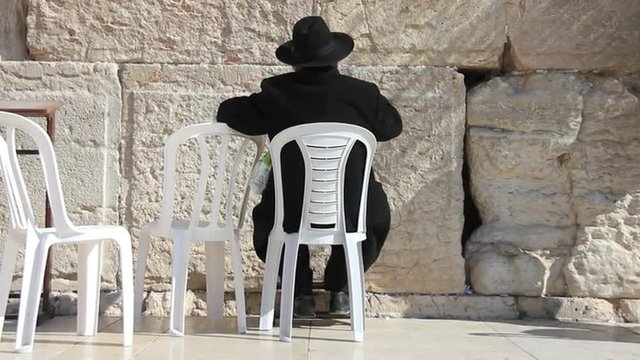 Orthodox hasidic Jew praying at Wailing Wall in Jerusalem, Isreal