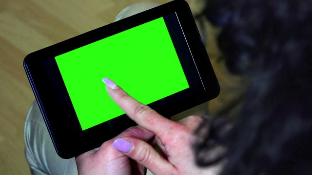 A woman holds a blank tablet PC 