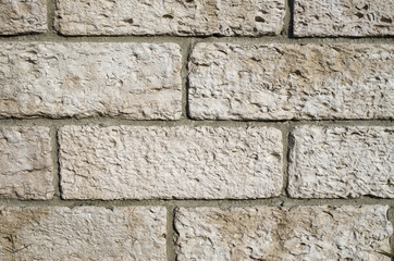 New stone wall closeup  in sunny day
