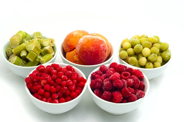 frozen berries separately on a white