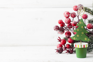 Christmas decoration with fir branches on the wood background.