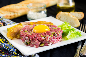 Raw beef steak tartare with French fries