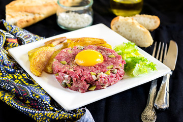 Raw beef steak tartare with French fries