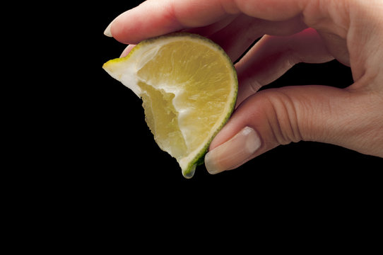 squeeze lime juice on hand separately the black background