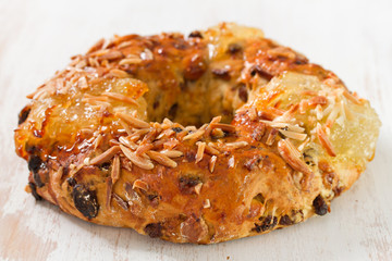 cake with dry fruits and nuts on white wooden background