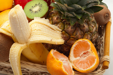 exotic fruits in the basket on white  background