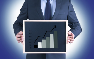 businessman with slate and graphics
