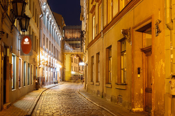 Naklejka na ściany i meble Night street in the Old Town of Riga, Latvia
