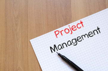 Project management write on notebook
