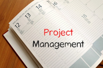 Project management write on notebook