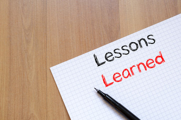 Lessons learned write on notebook