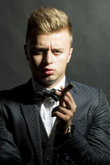 Portrait of sexy man with cigar
