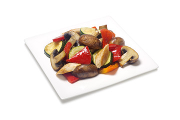 Sauteed zucchini with chicken mushrooms pepper on a white background
