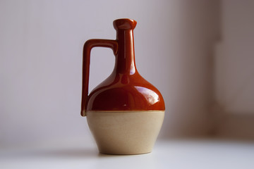 Ancient Wine Jug. Red and White Colors.