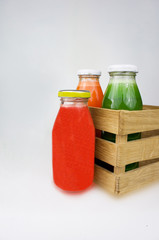 Fresh vegetable juices isolated on white