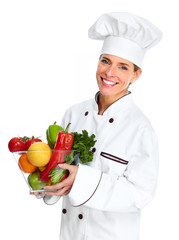 Chef woman with vegetables.