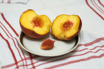 Two peaches on the table napkin
