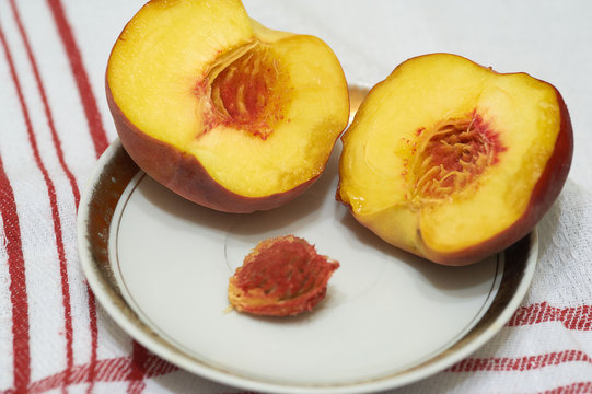 Two peaches on the table napkin
