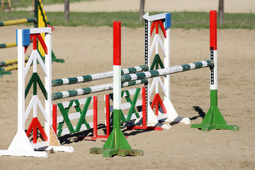 Barriers on the ground for jumping horses as a background