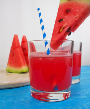 Healthy watermelon smoothie on a wood background