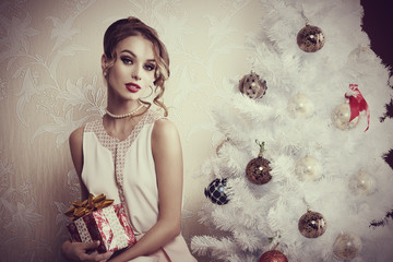 elegant girl near christmas tree