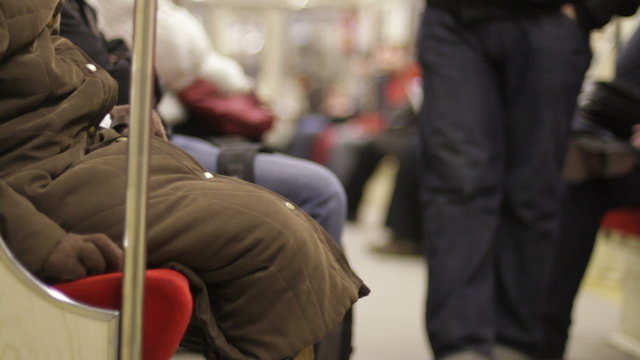 Passengers aboard subway train
